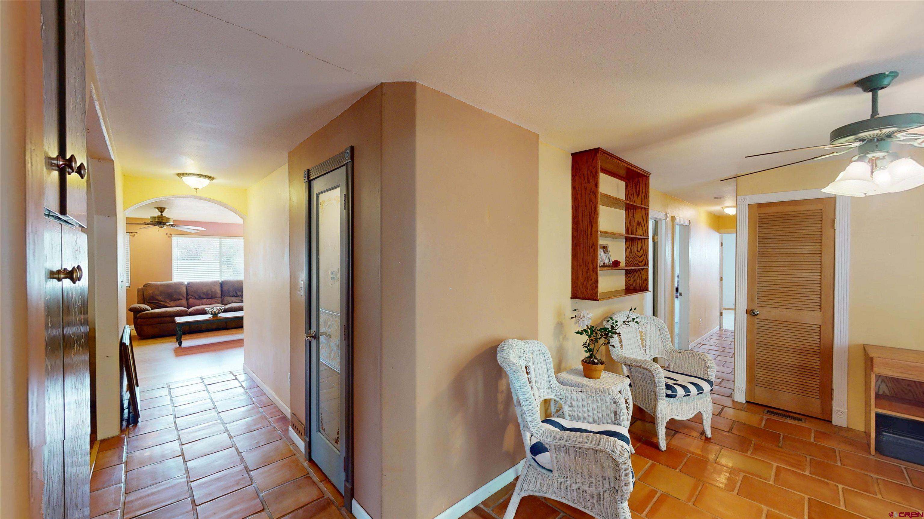 100 Rio Grande Avenue Paonia, CO 81428 - Photo 24 of 45 a view of a hallway and a livingroom with furniture