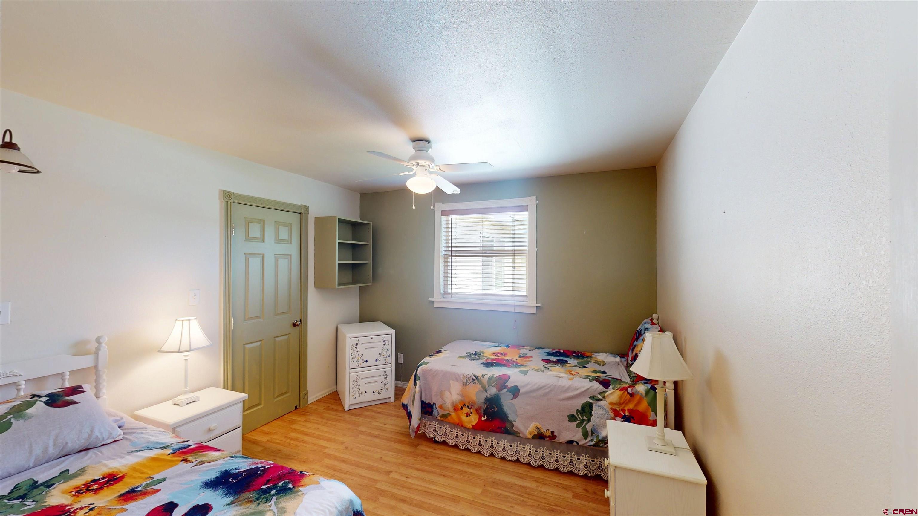 100 Rio Grande Avenue Paonia, CO 81428 - Photo 25 of 45 a bedroom with a bed and wooden floor