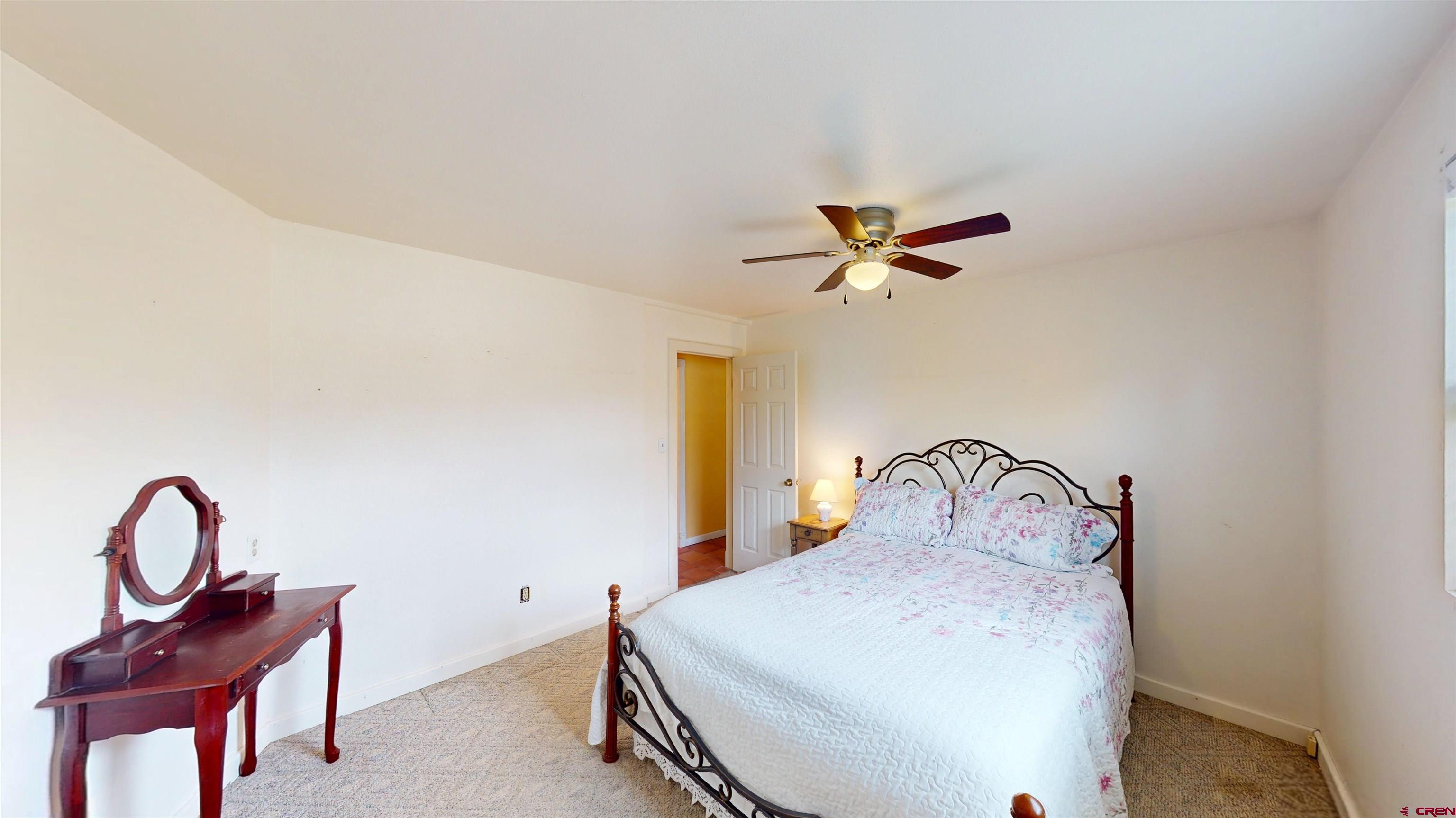 100 Rio Grande Avenue Paonia, CO 81428 - Photo 28 of 45 a bedroom with a bed and a dresser