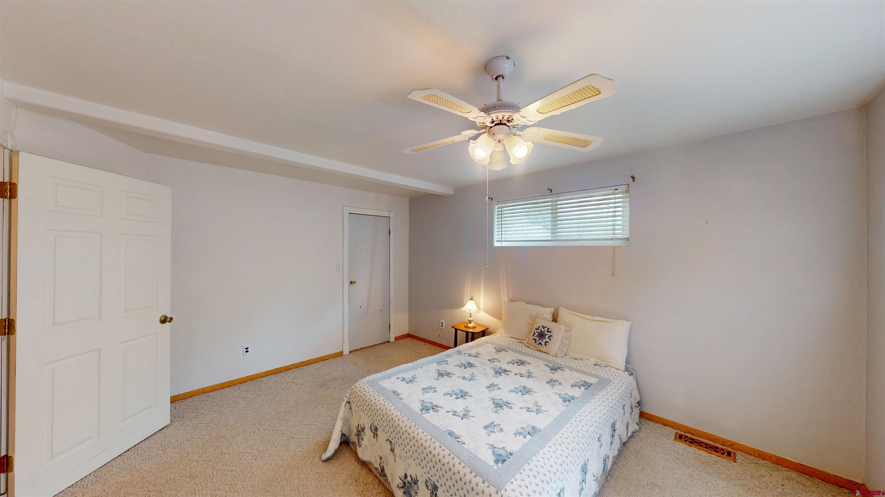 100 Rio Grande Avenue Paonia, CO 81428 - Photo 35 of 45 a bedroom with a bed and a window
