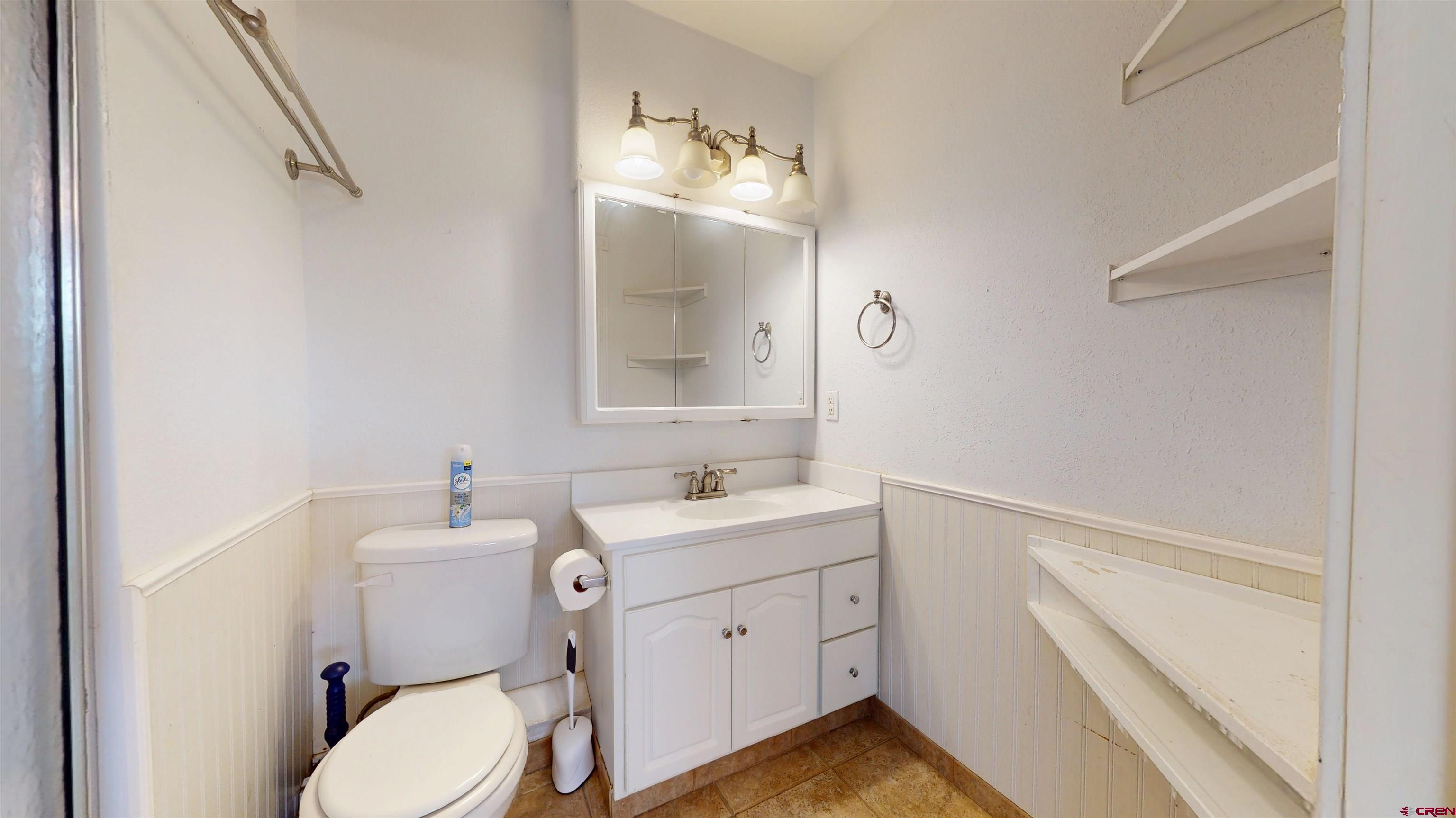 100 Rio Grande Avenue Paonia, CO 81428 - Photo 38 of 45 a bathroom with a toilet sink and mirror