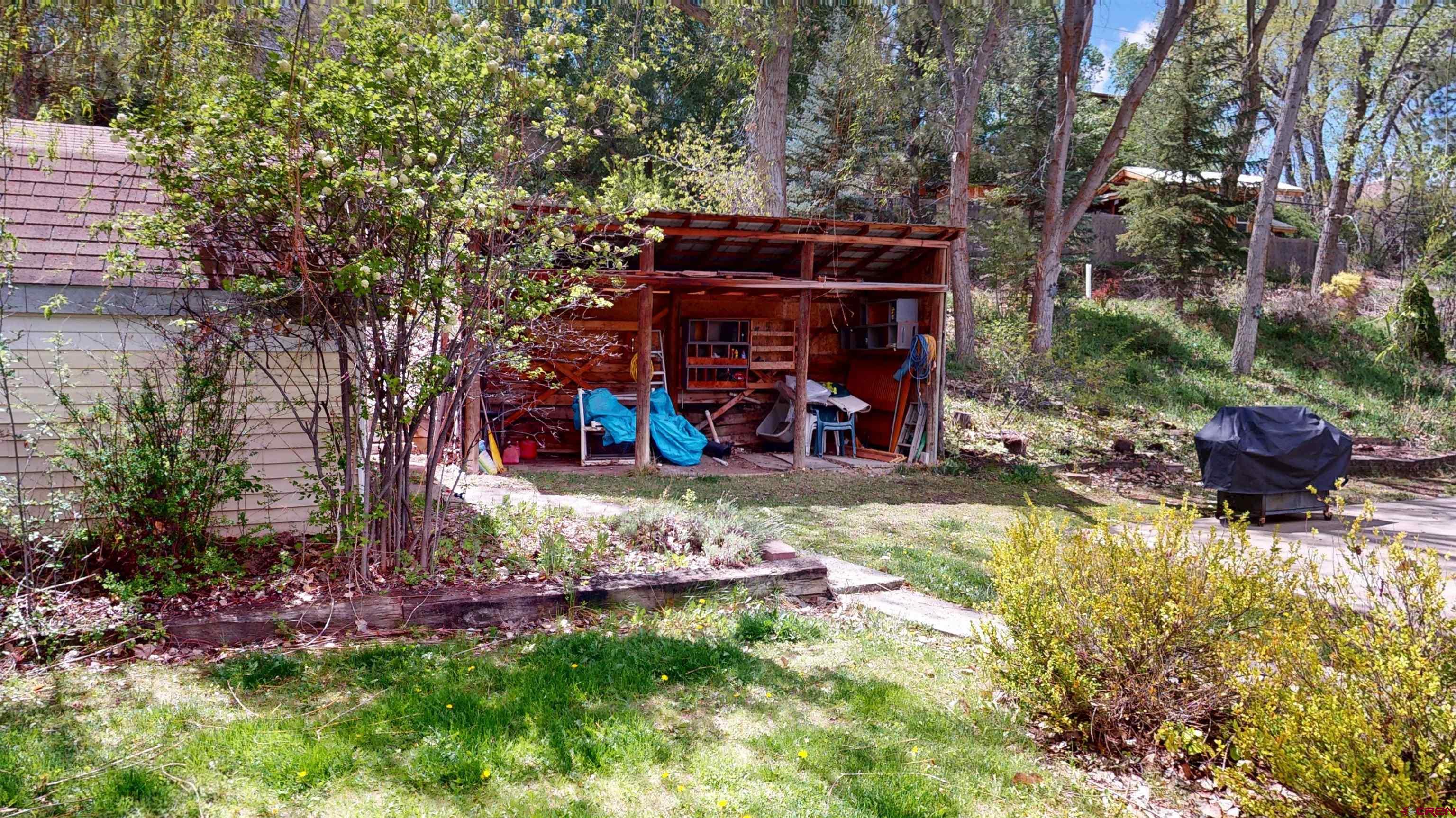 100 Rio Grande Avenue Paonia, CO 81428 - Photo 40 of 45 a view of a chair and table in backyard of the house