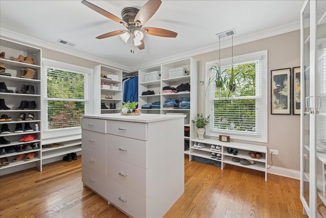 a kitchen with a refrigerator a stove a sink and a large window