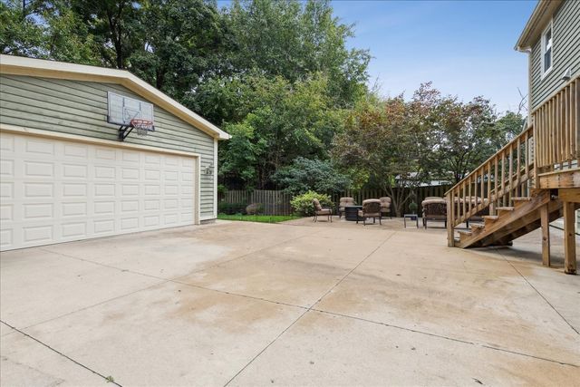 a view of backyard with deck and trees