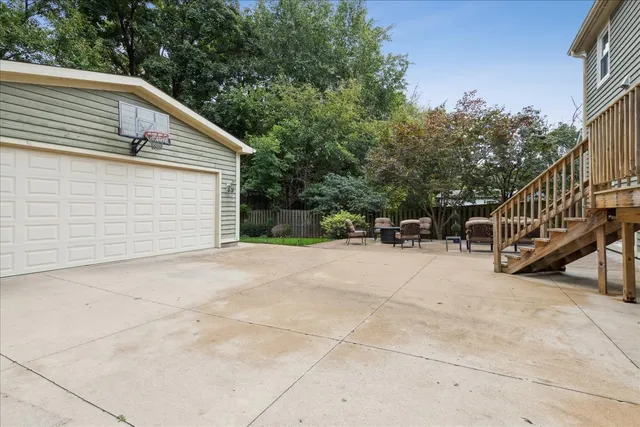 a view of backyard with deck and trees