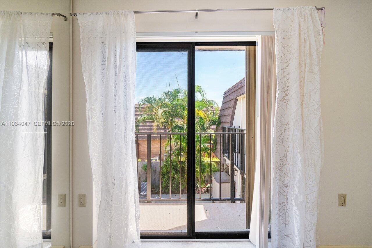 1619 16th Court Jupiter, FL 33477 - Photo 20 of 31 a view of a glass door with a porch