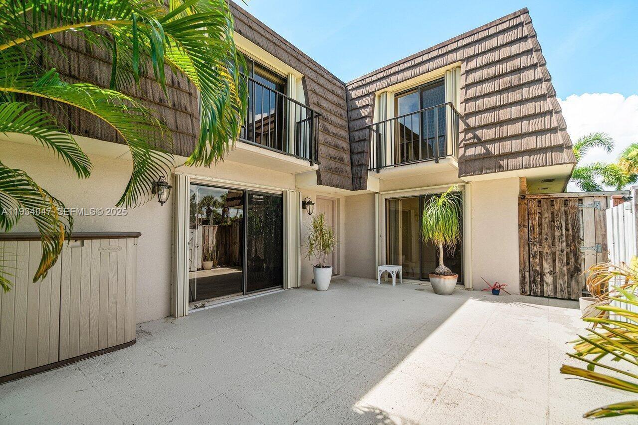1619 16th Court Jupiter, FL 33477 - Photo 9 of 31 a view of a house with a patio