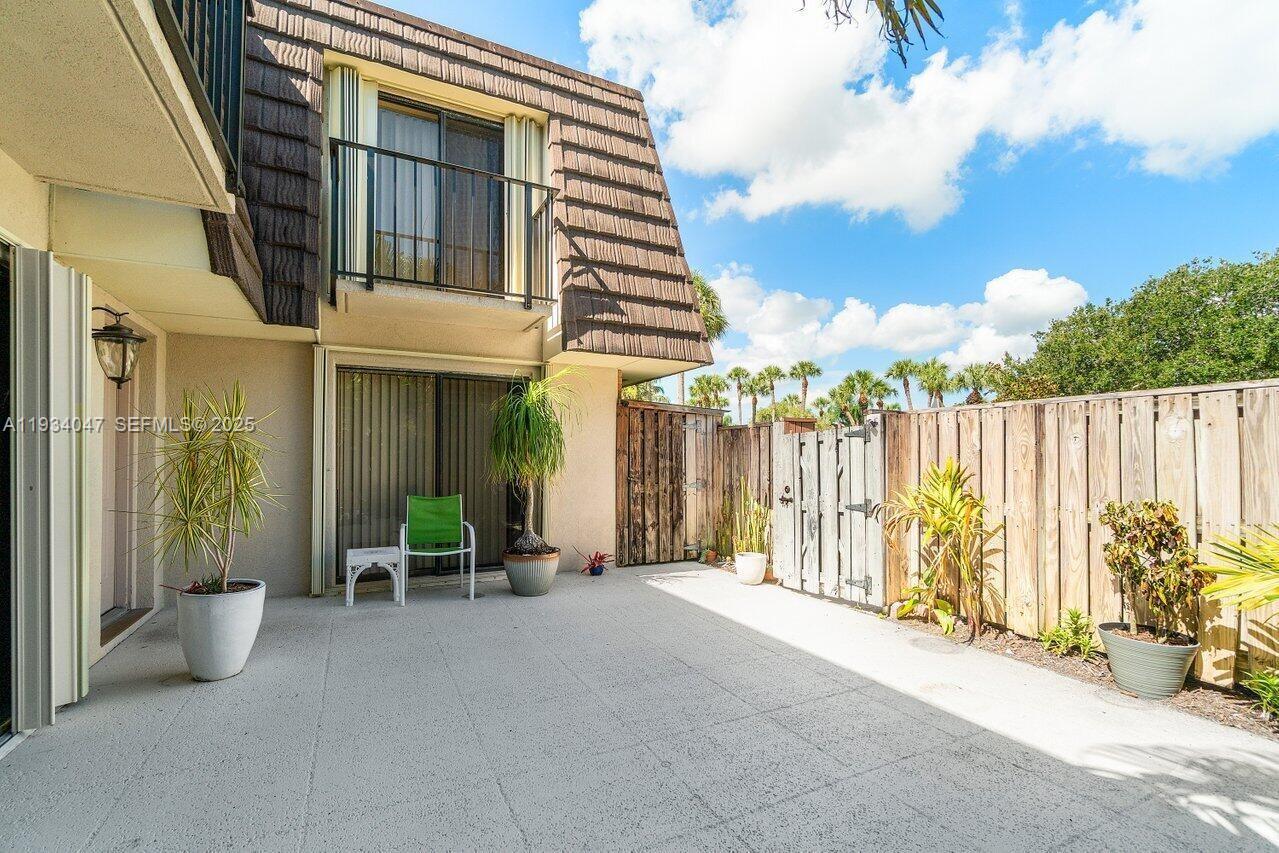 1619 16th Court Jupiter, FL 33477 - Photo 10 of 31 a view of a chairs with a porch