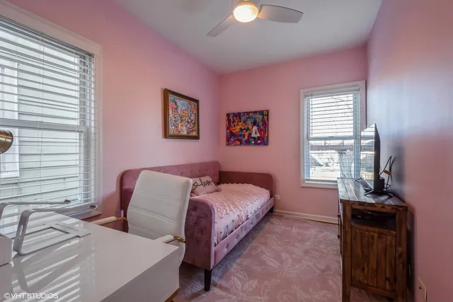 a spacious bedroom with a bed and a window