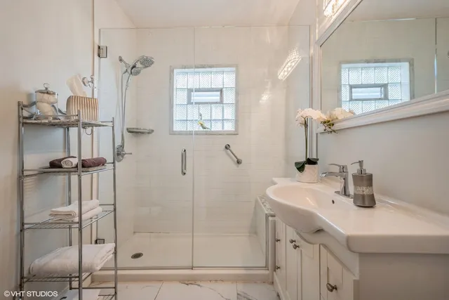 a bathroom with a sink and mirror