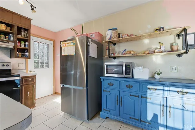 a bathroom with a toilet a sink and a window