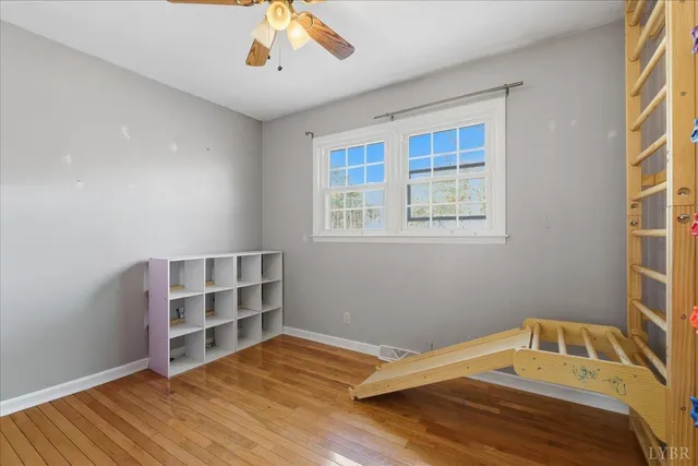 a spacious bathroom with a granite countertop sink a mirror and a bathtub
