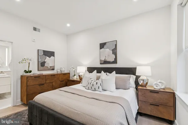 a bedroom with bed and window