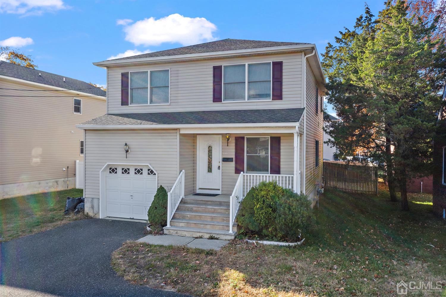66 Helmetta Road Monroe Township, NJ 08831 - Photo 1 of 25 a front view of a house with garden