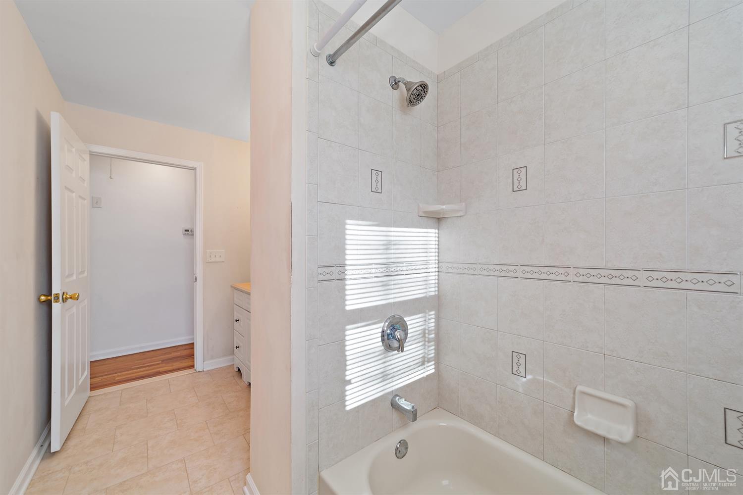 66 Helmetta Road Monroe Township, NJ 08831 - Photo 17 of 25 a bathroom with a sink a toilet and shower