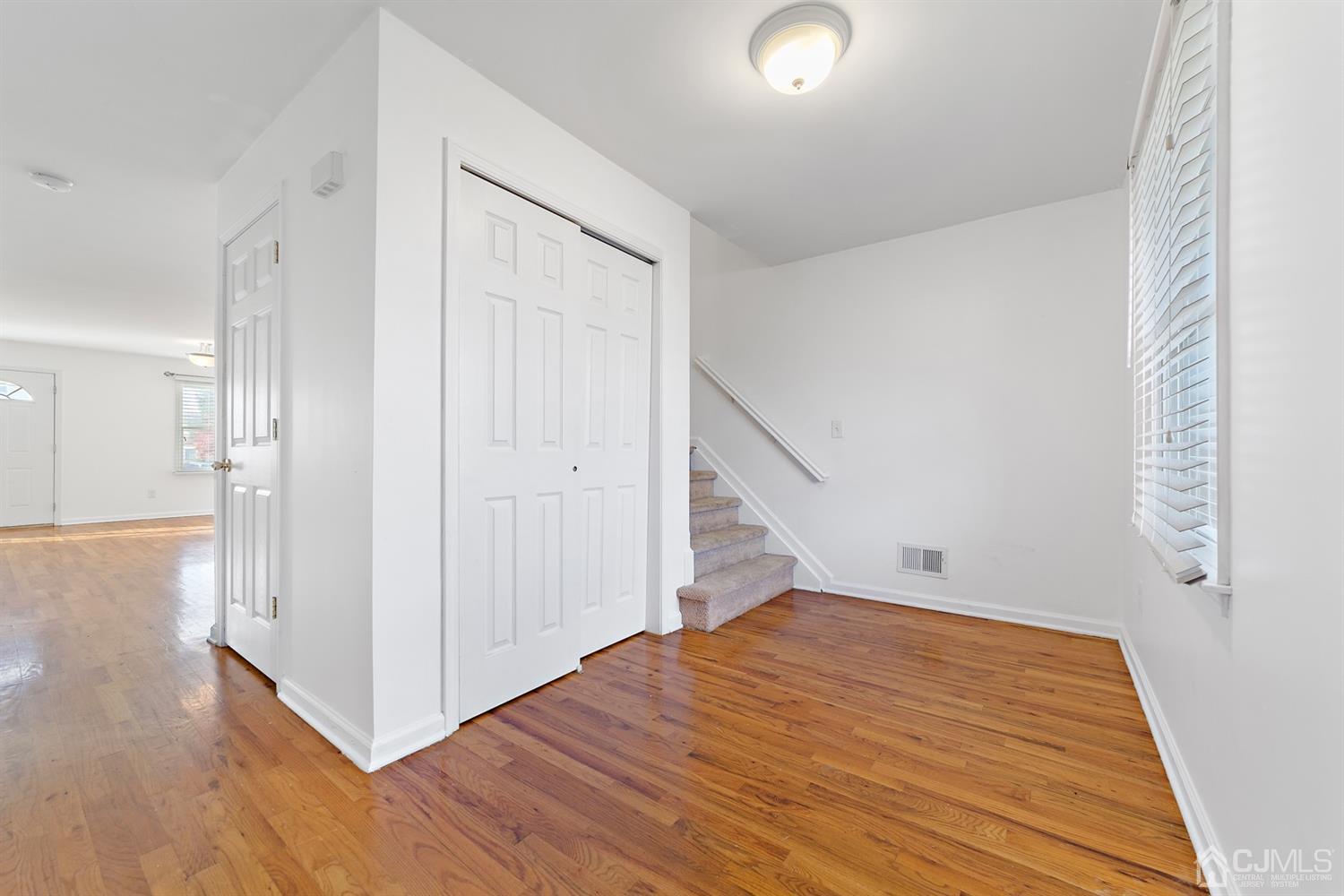 66 Helmetta Road Monroe Township, NJ 08831 - Photo 4 of 25 a view of a hallway with wooden floor