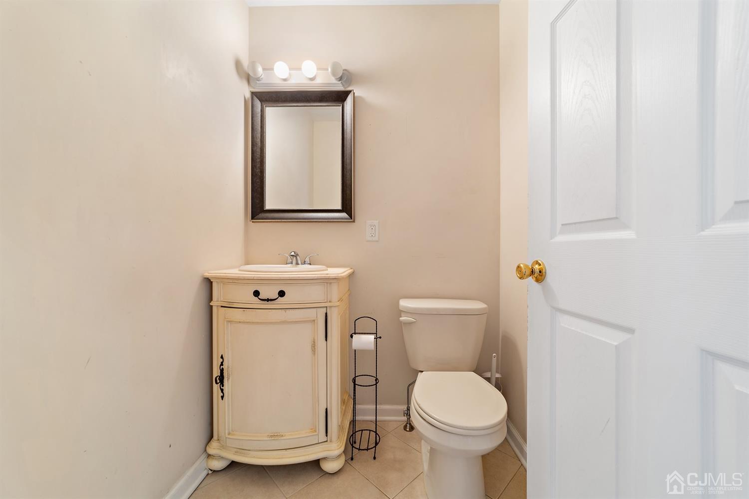 66 Helmetta Road Monroe Township, NJ 08831 - Photo 10 of 25 a white toilet sitting next to a bathroom sink