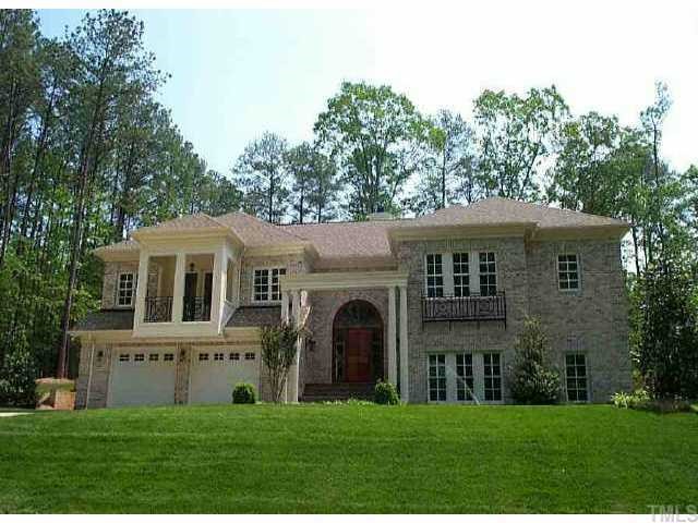 5208 Atherton Bridge Road Raleigh, NC 27613 - Photo 1 of 1 a front view of a house with a yard and garage