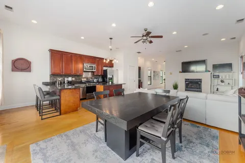 a kitchen with stainless steel appliances granite countertop a stove a sink dishwasher and a refrigerator