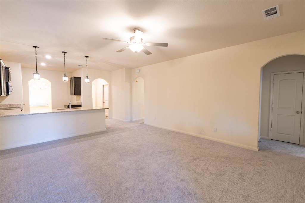 208 Liberty Lane Venus, TX 76084 - Photo 13 of 29 Living Room With View Into Kitchen