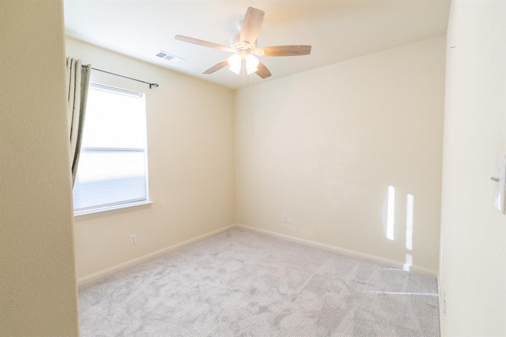 208 Liberty Lane Venus, TX 76084 - Photo 22 of 29 Second Bedroom With Ceiling Fan & Carpet