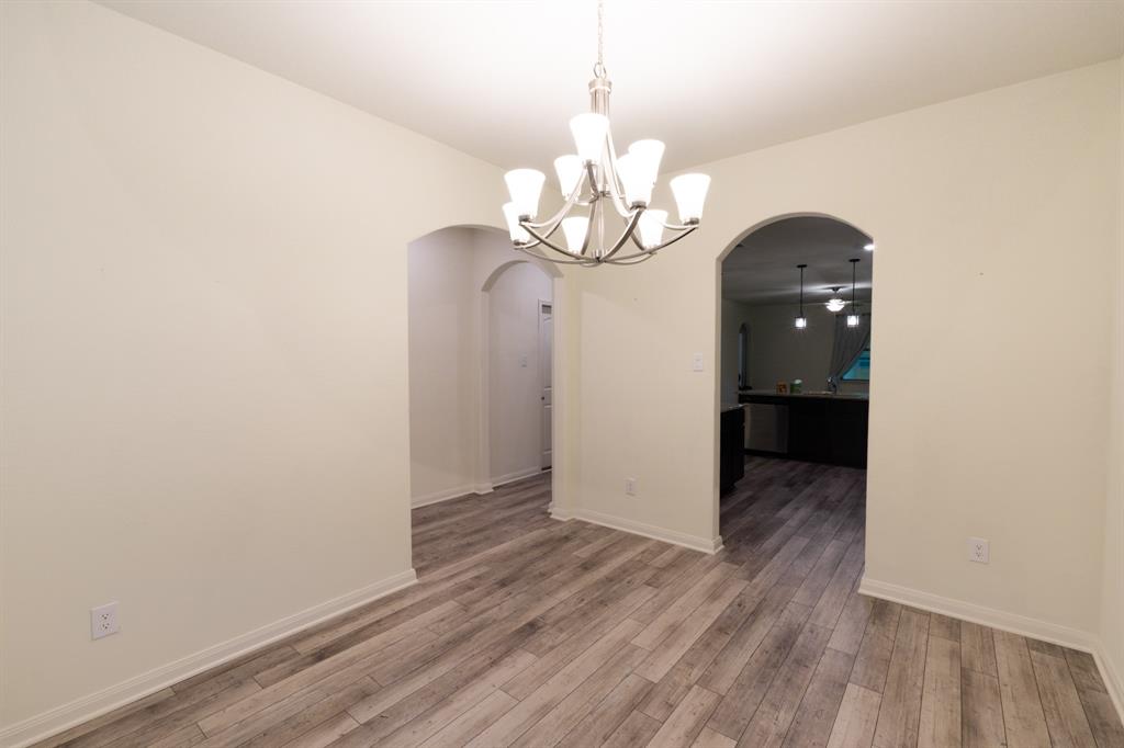 208 Liberty Lane Venus, TX 76084 - Photo 6 of 29 Dining Room Featuring Chandelier Lighting