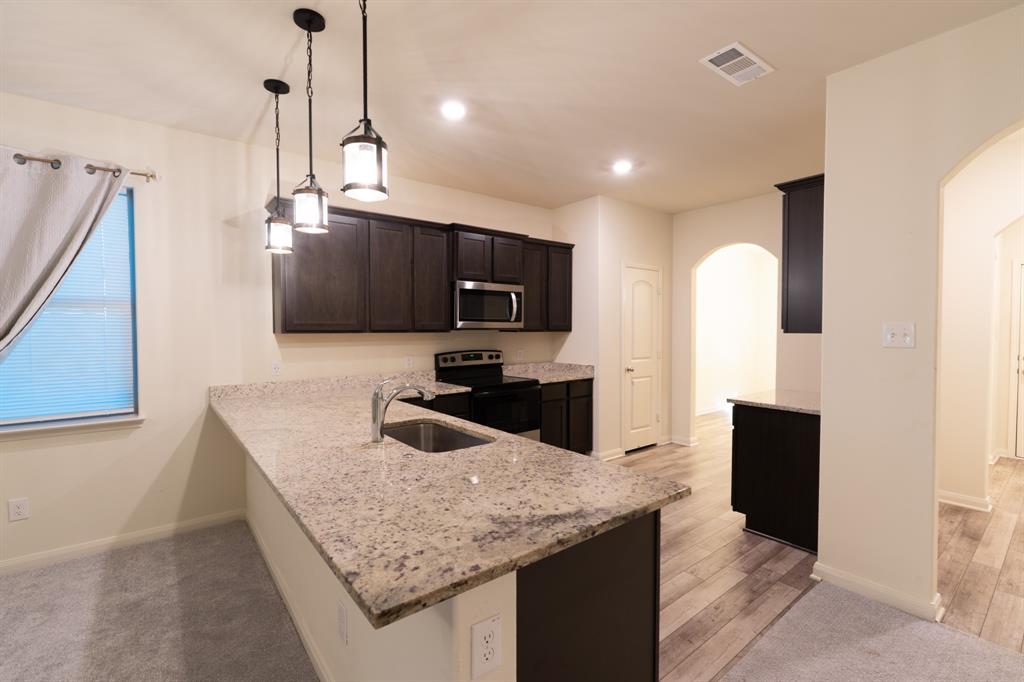 208 Liberty Lane Venus, TX 76084 - Photo 10 of 29 View of Kitchen Granite Breakfast Bar Countertops