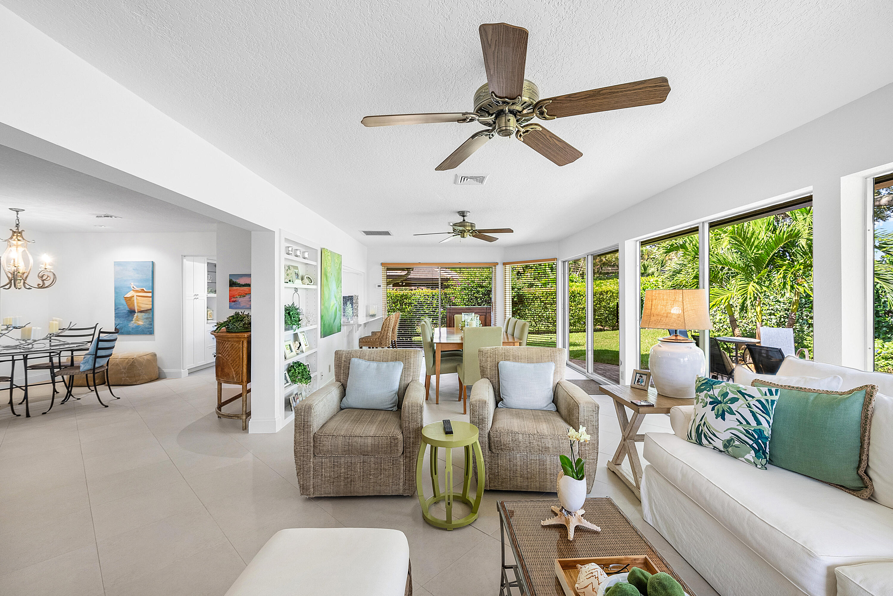 481 Forestview Drive Atlantis, FL 33462 - Photo 20 of 68 a living room with furniture and floor to ceiling windows