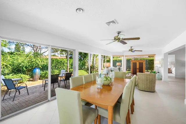 a spacious bedroom with a bed and a flat screen tv