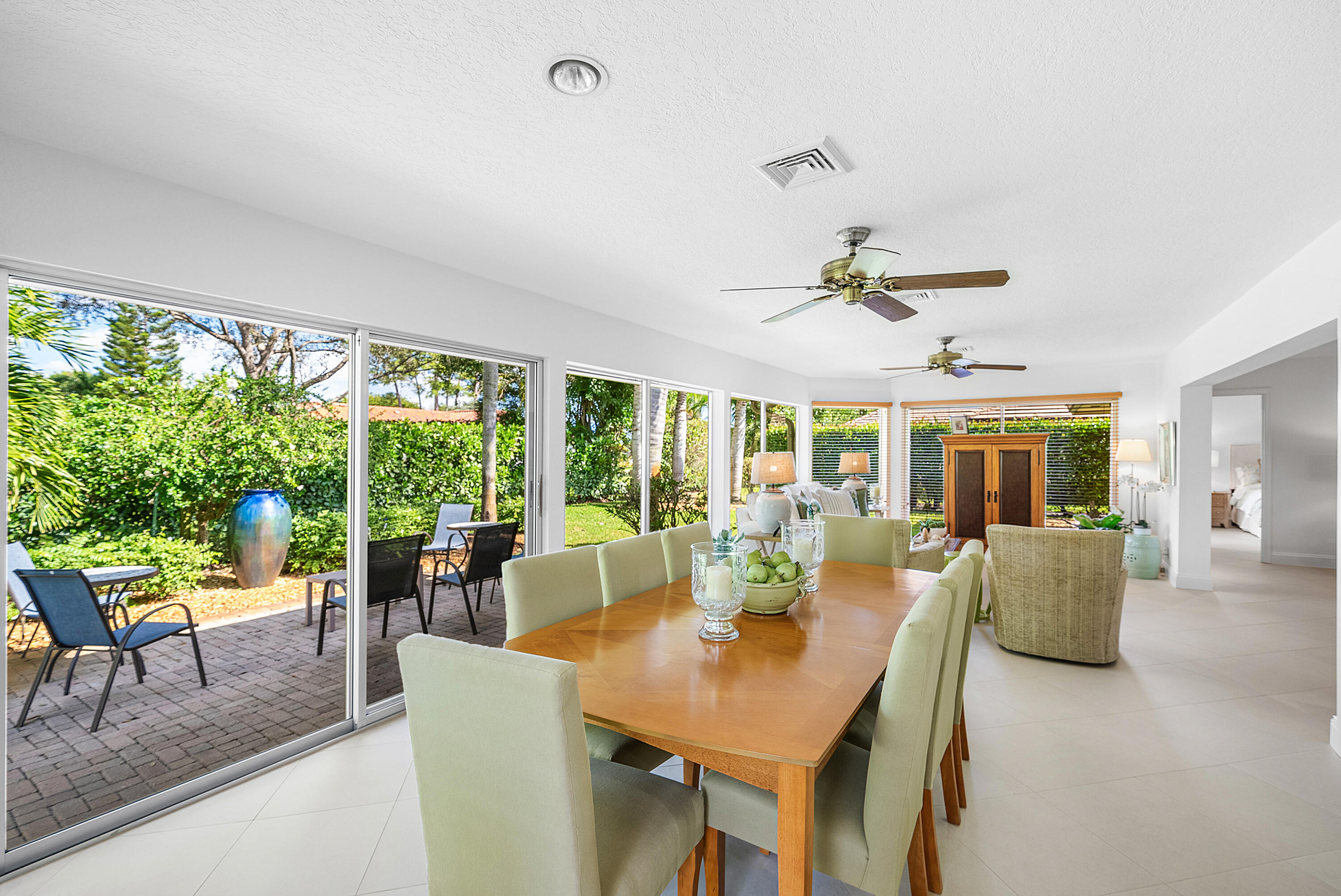 481 Forestview Drive Atlantis, FL 33462 - Photo 23 of 68 a view of a dining room with furniture window and outside view