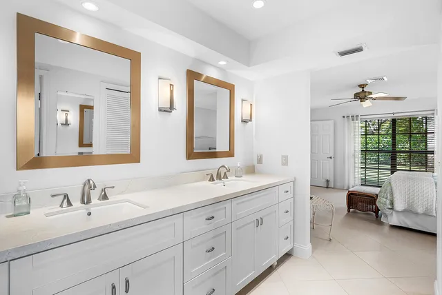 a view of a chair and table in backyard of the house