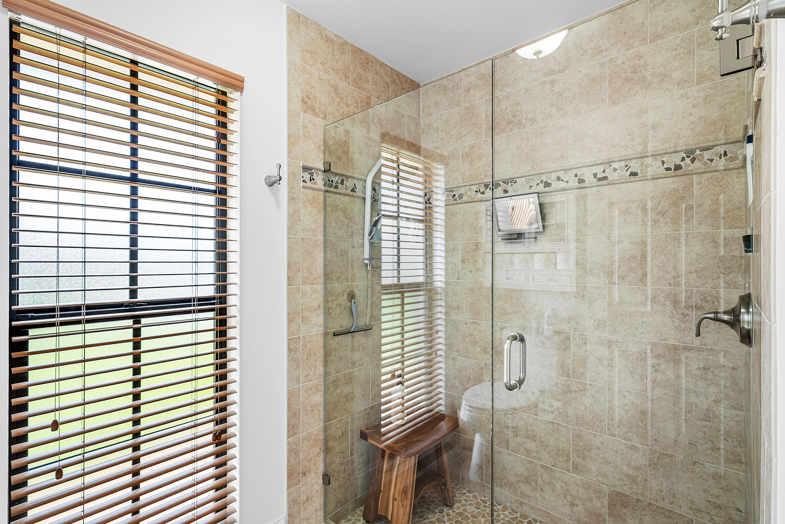 481 Forestview Drive Atlantis, FL 33462 - Photo 34 of 68 a bathroom with a shower and a sink