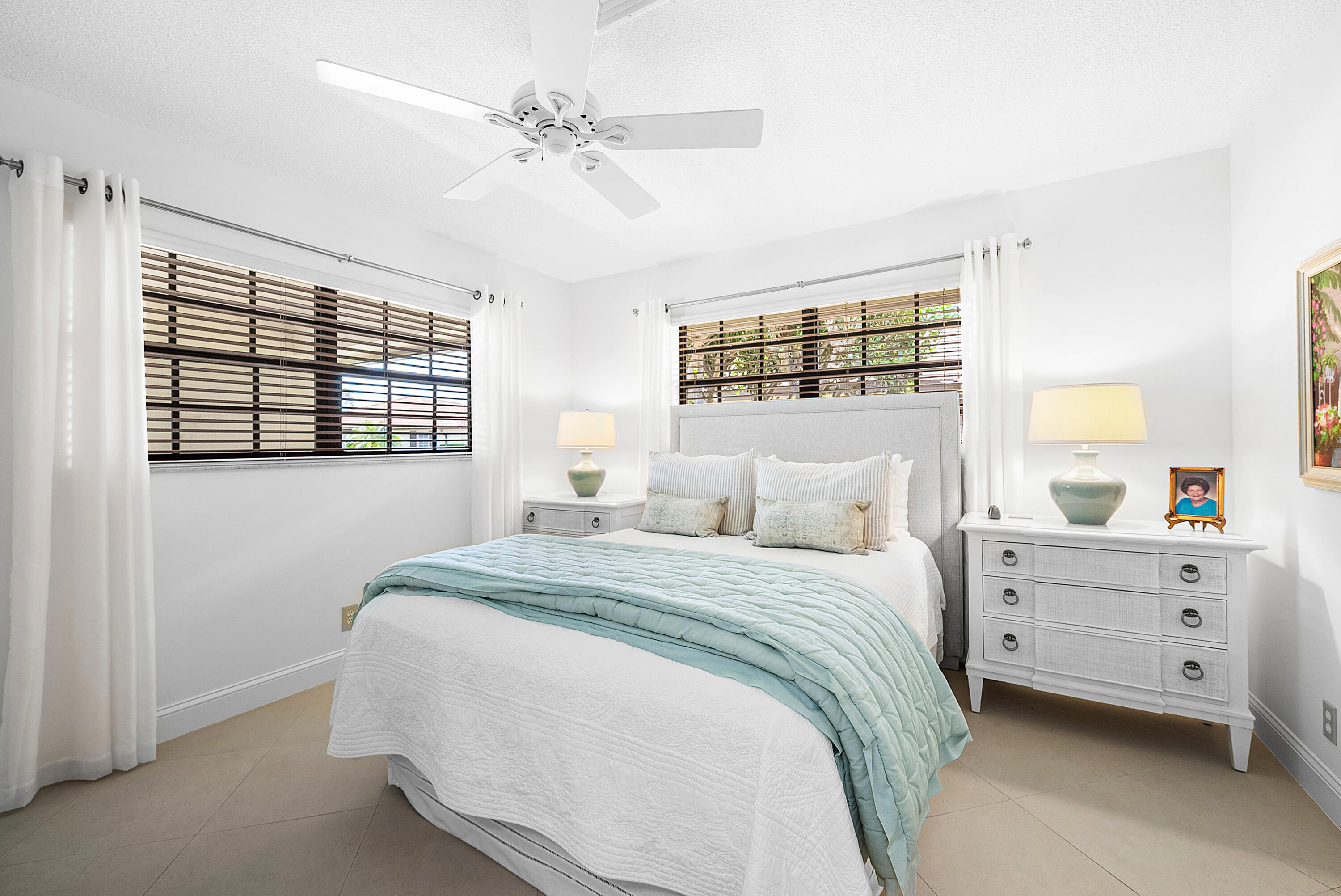 481 Forestview Drive Atlantis, FL 33462 - Photo 38 of 68 a bedroom with a bed and a window