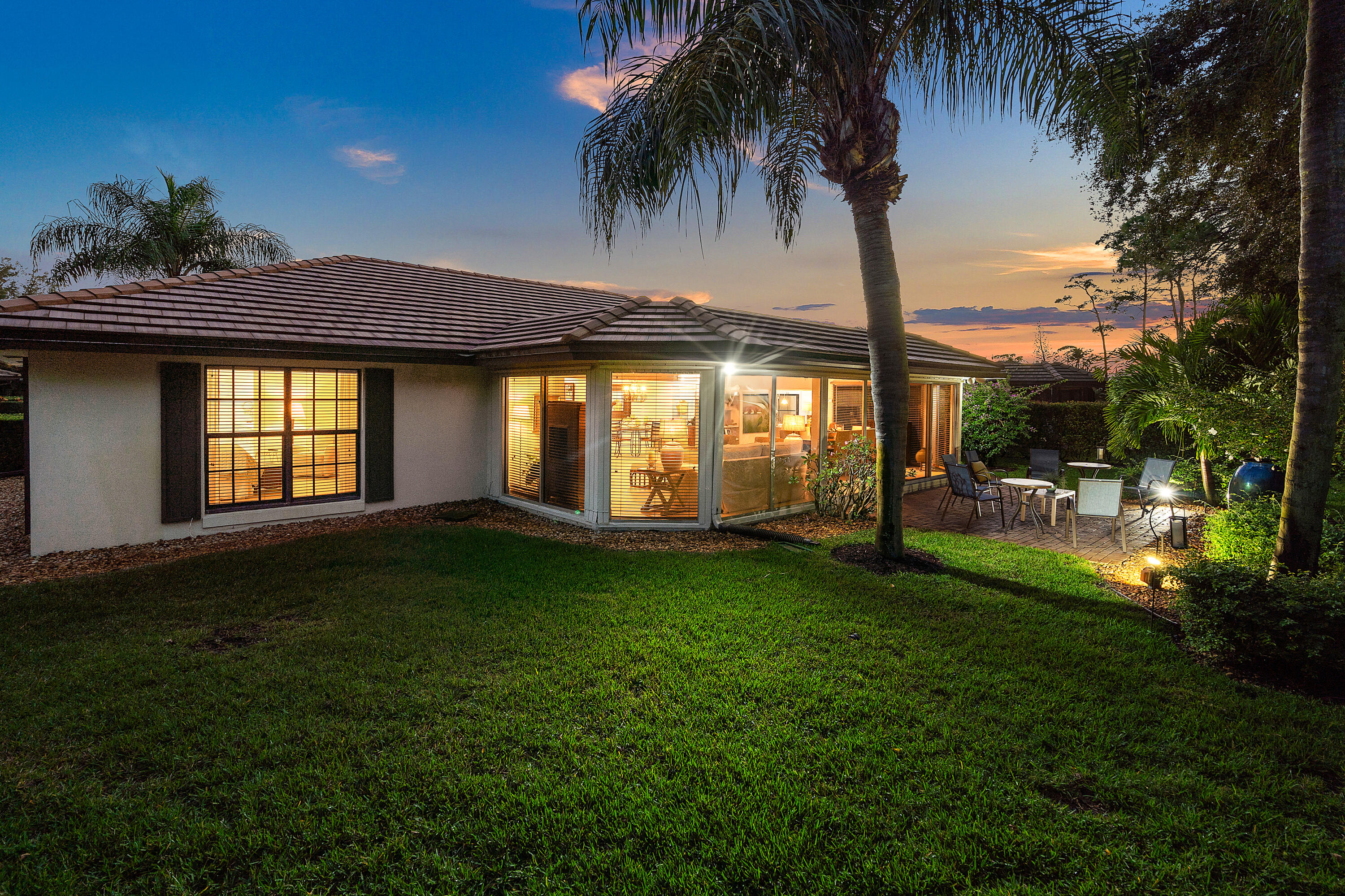 481 Forestview Drive Atlantis, FL 33462 - Photo 61 of 68 a house view with a garden space