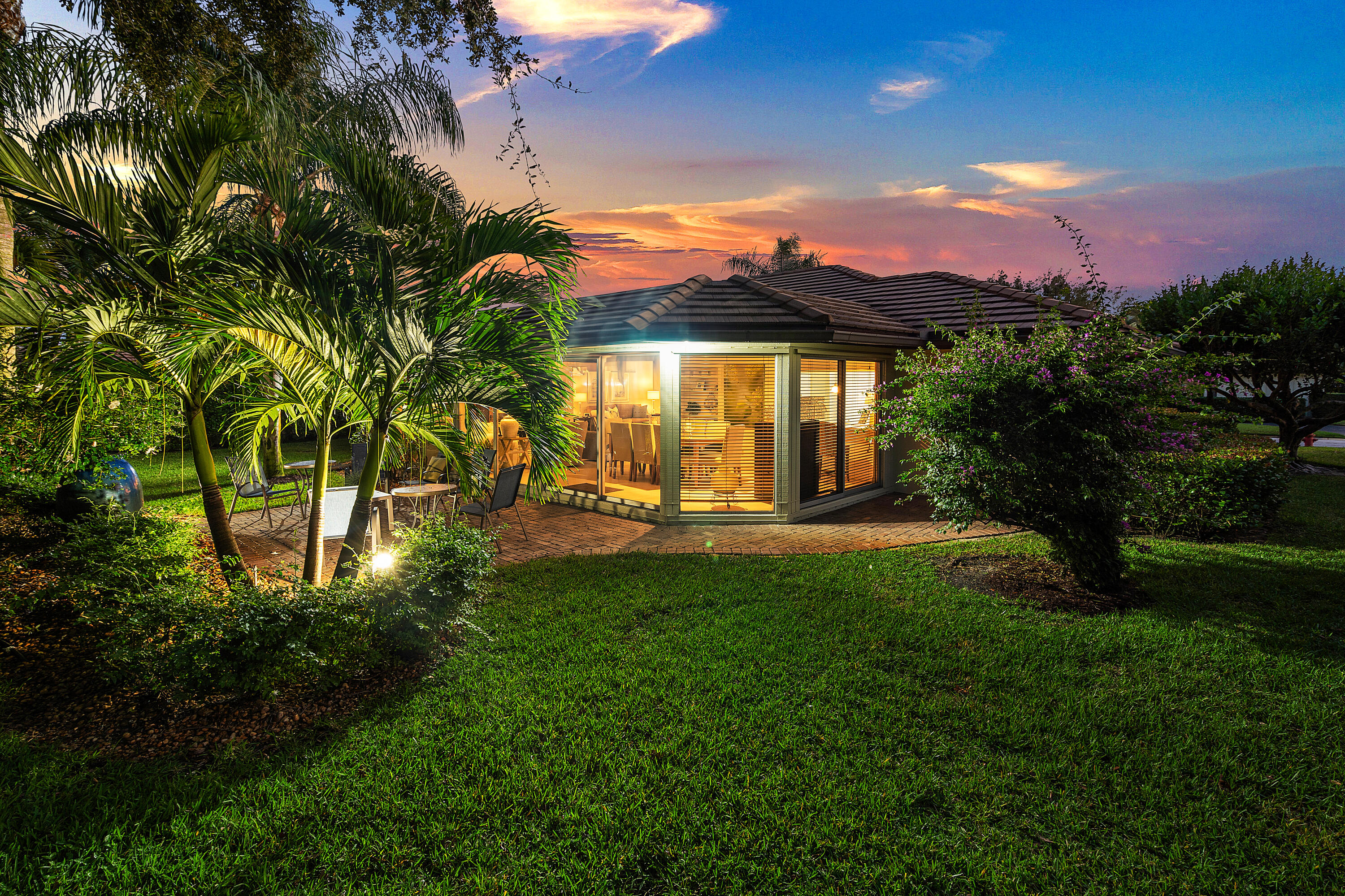 481 Forestview Drive Atlantis, FL 33462 - Photo 64 of 68 a front view of a house with a yard
