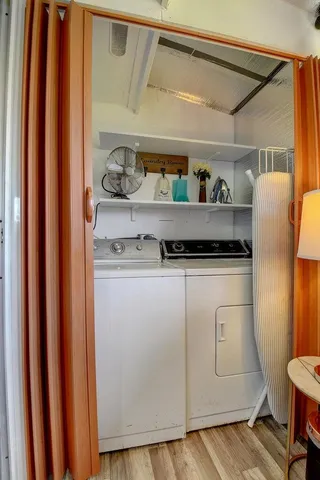 a view of a swimming pool with a patio and a yard