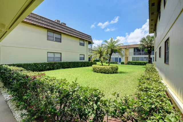 a living room with furniture and a pool table