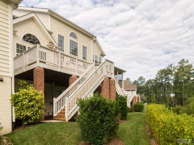 11545 Auldbury Way Raleigh, NC 27617 - Photo 20 of 25 The back of the home is quite lovely and offers architectural details such a brick pillars for the deck and a distinctive palladium window. Exterior Back