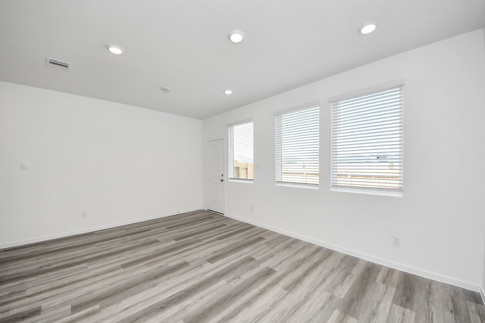 1006 Moon Drop Lane Houston, TX 77090 - Photo 13 of 38 a view of a room with wooden floor and window