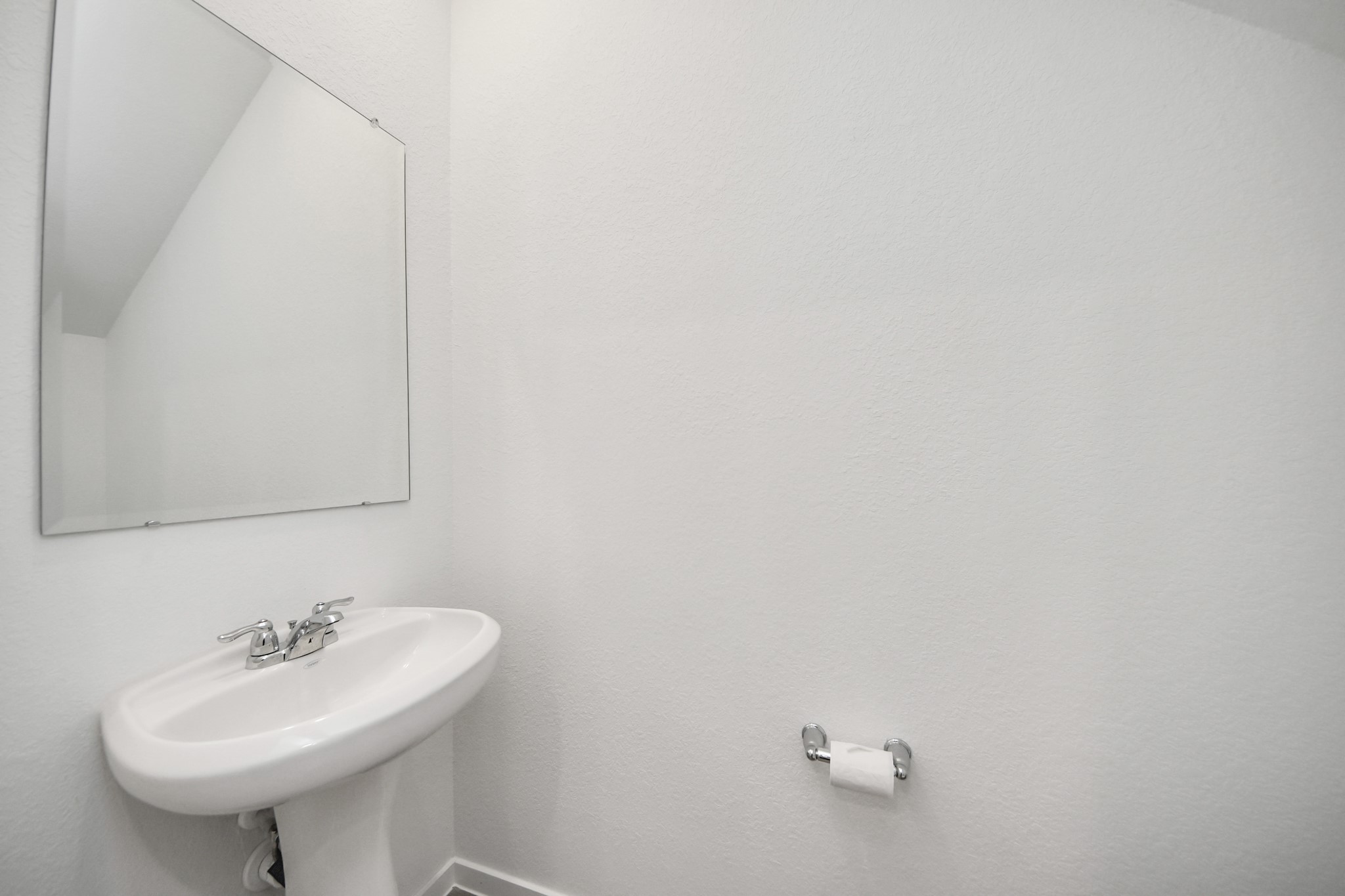 1006 Moon Drop Lane Houston, TX 77090 - Photo 17 of 38 a bathroom with a sink and a mirror