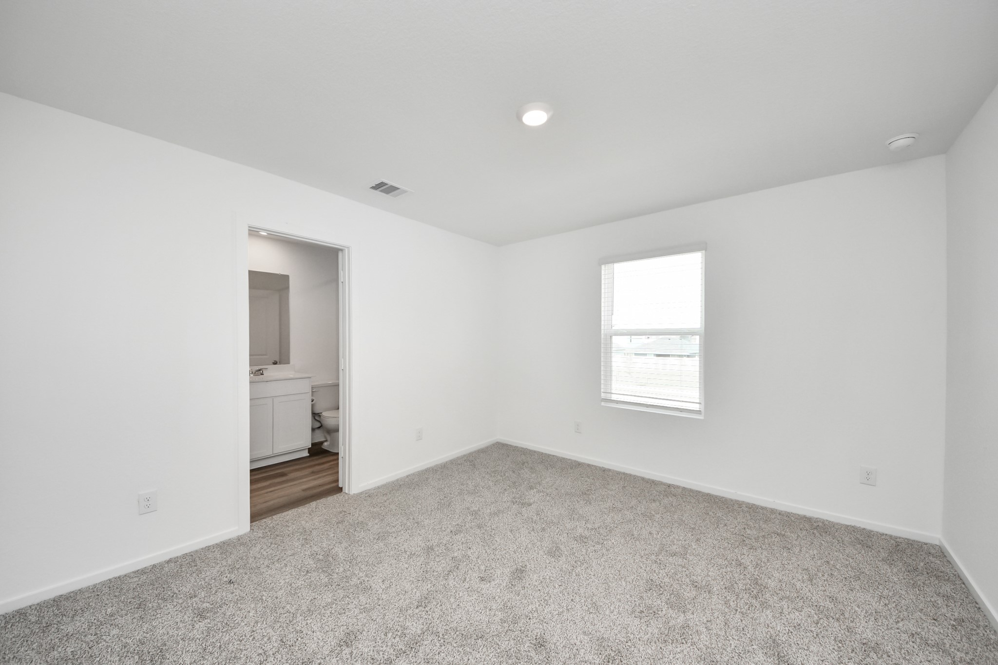 1006 Moon Drop Lane Houston, TX 77090 - Photo 19 of 38 an empty room with a window