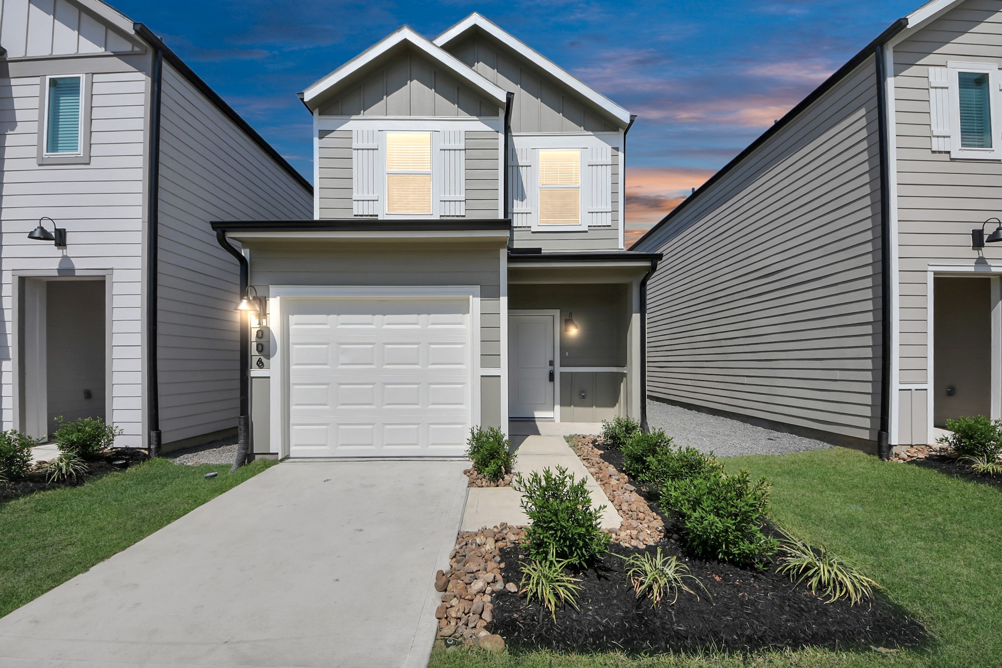 1006 Moon Drop Lane Houston, TX 77090 - Photo 2 of 38 a front view of a house with garden