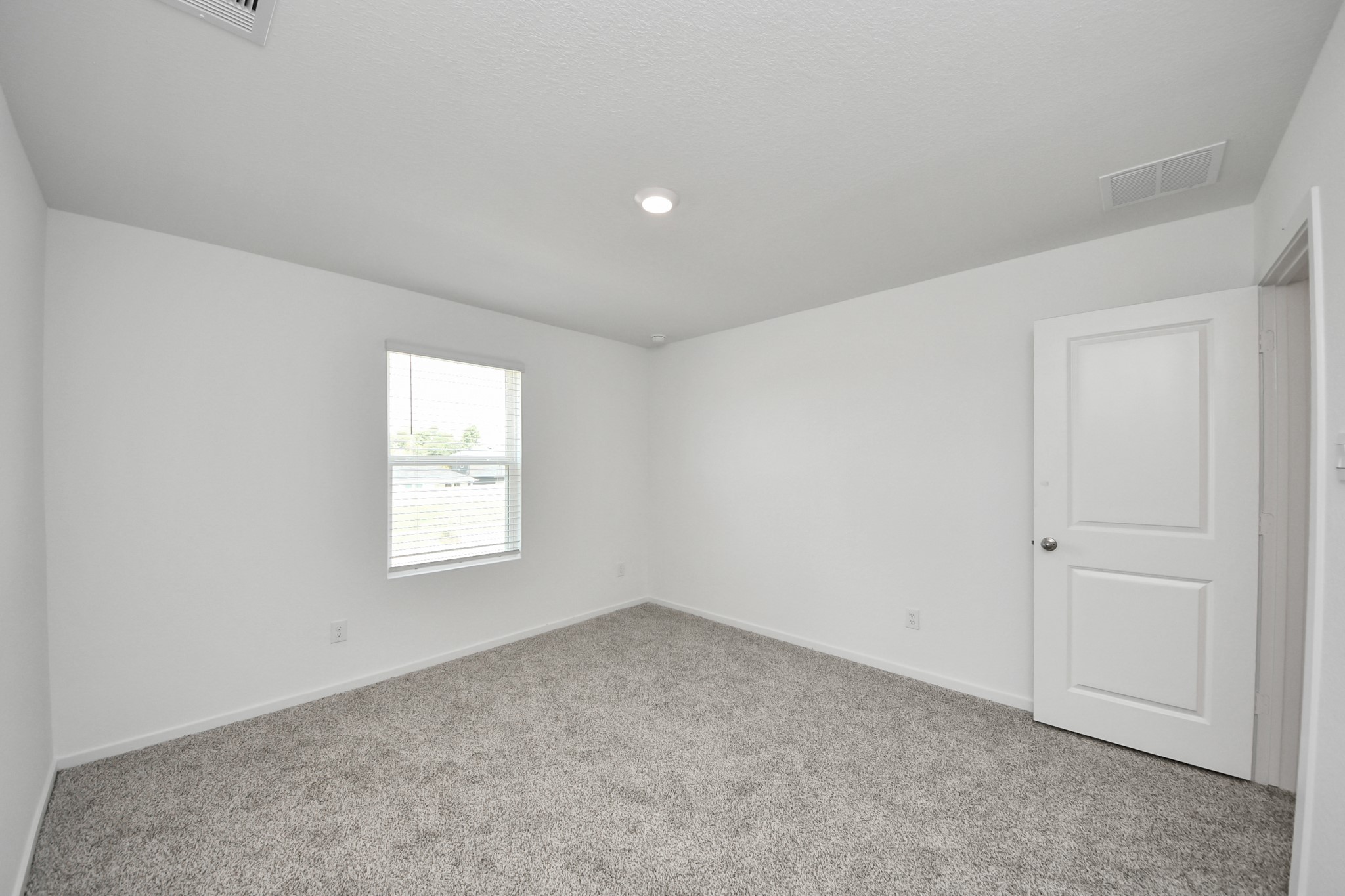 1006 Moon Drop Lane Houston, TX 77090 - Photo 21 of 38 an empty room with windows