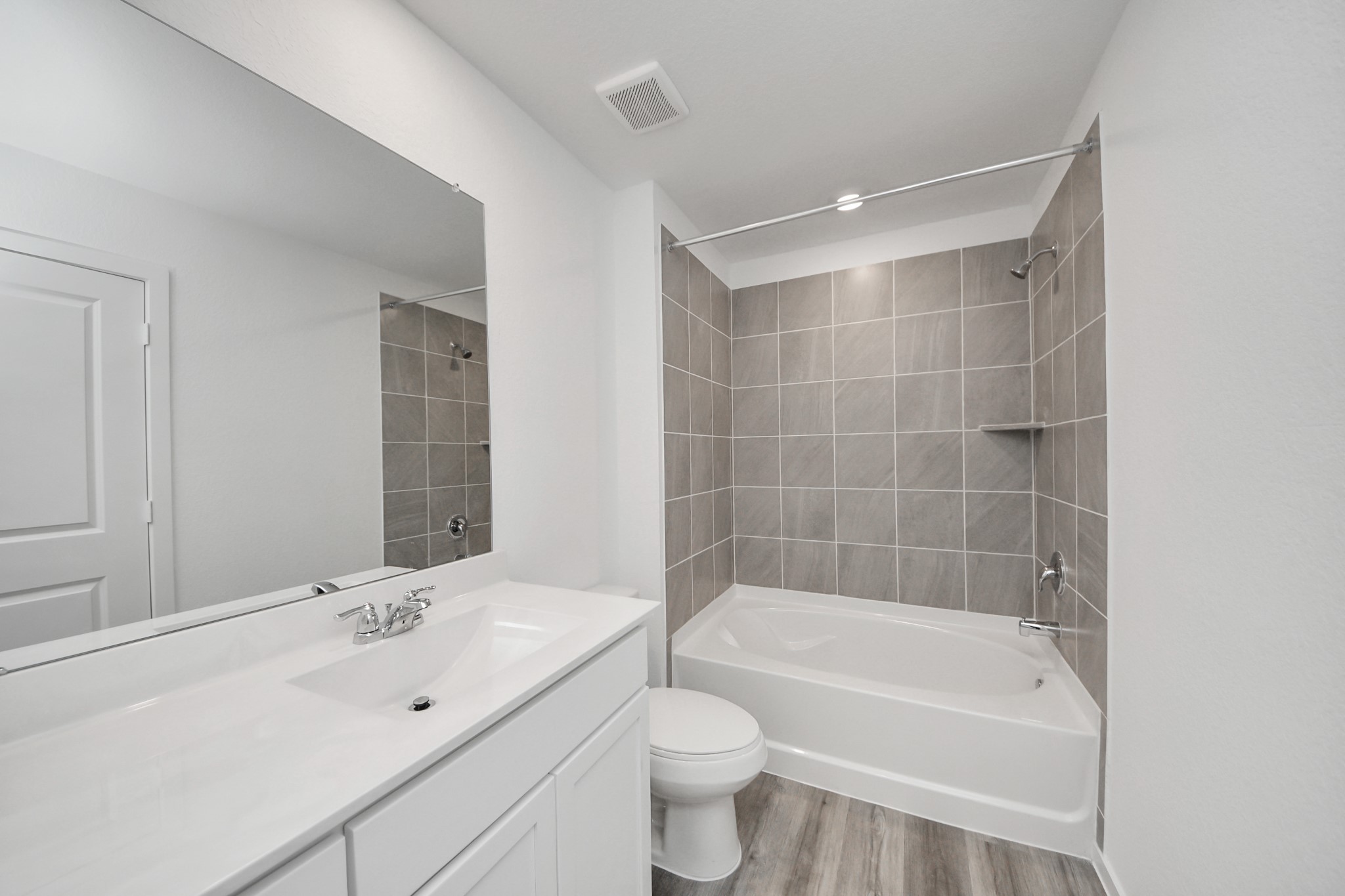 1006 Moon Drop Lane Houston, TX 77090 - Photo 24 of 38 a bathroom with a bathtub shower sink vanity and toilet