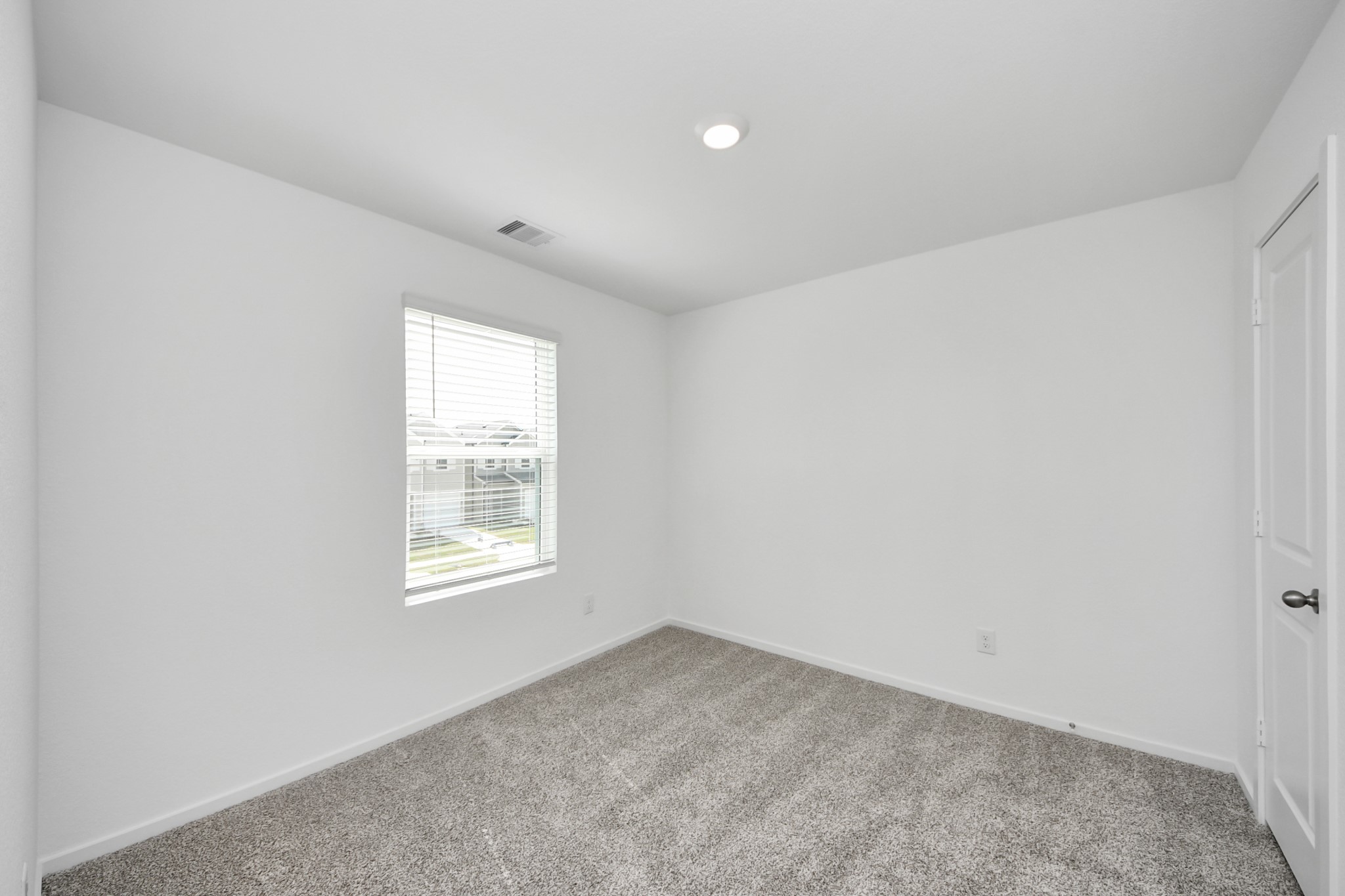 1006 Moon Drop Lane Houston, TX 77090 - Photo 31 of 38 an empty room with a window