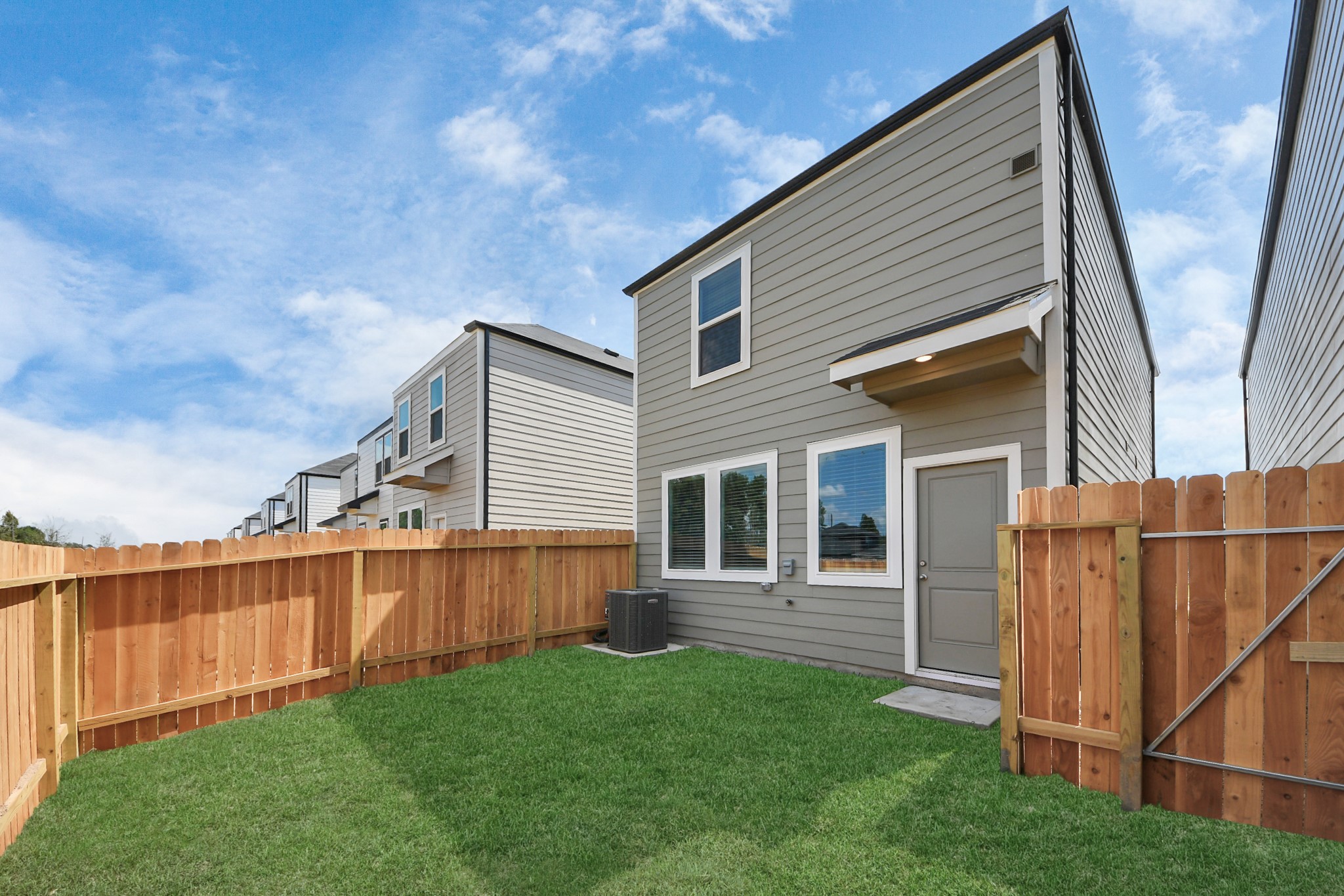 1006 Moon Drop Lane Houston, TX 77090 - Photo 34 of 38 a backyard of a house with lots of green space