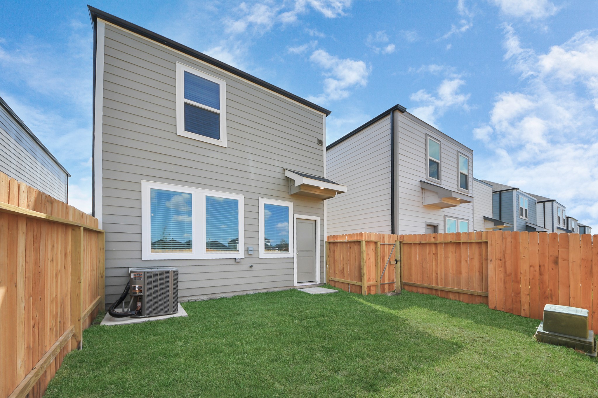 1006 Moon Drop Lane Houston, TX 77090 - Photo 35 of 38 a front view of a house with garden