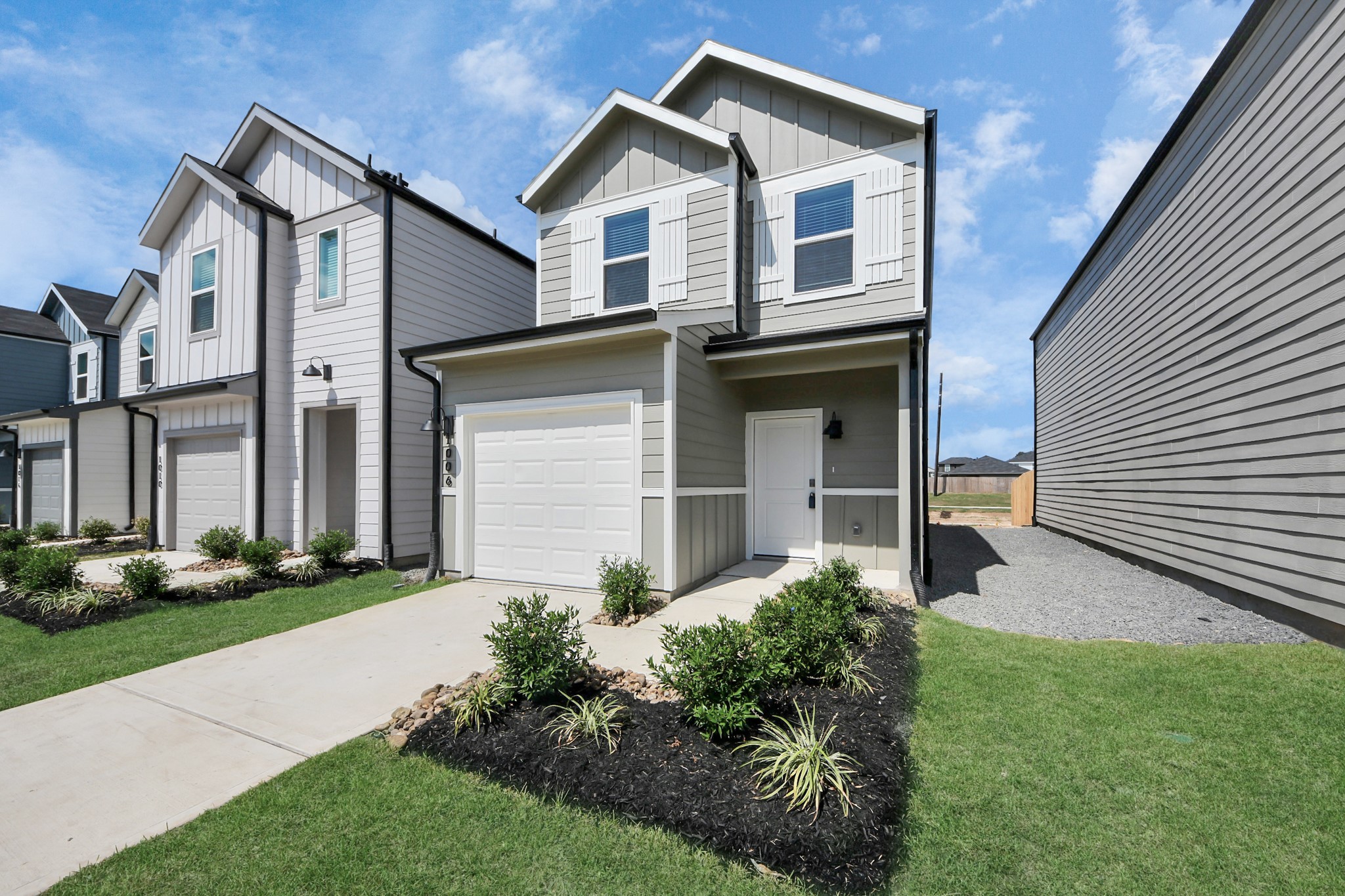 1006 Moon Drop Lane Houston, TX 77090 - Photo 37 of 38 a front view of a house with garden