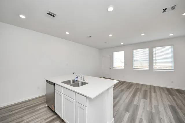 a kitchen with a sink and refrigerator