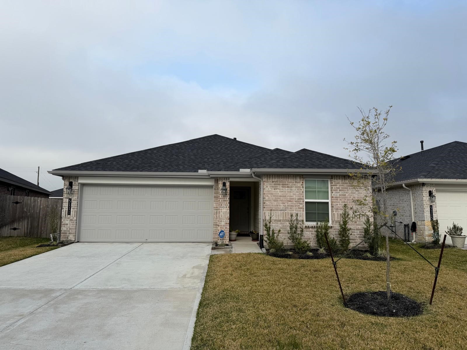 5111 Hunters Trail Fresno, TX 77545 - Photo 1 of 16 a view of a house with a yard and garage
